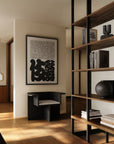 Modern Japandi theme interior with wooden shelves, books, and decorative items.