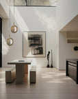 Modern Japandi theme kitchen with a dining table, pendant lights, and artwork on the wall.
