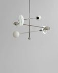 Modern chandelier with spherical lights on a gray background