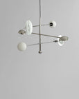 Modern chandelier with spherical lights on a gray background