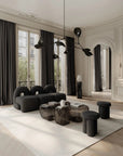 Modern living room with black furniture and large windows