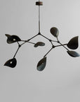 Modern black chandelier against a gray background
