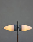 Modern floor lamp with two oval lights on a dark gray background