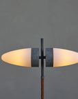 Modern floor lamp with two oval lights on a dark gray background