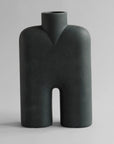 Dark gray abstract vase on a light gray background from 101 Copenhagen at Spacio retail stores in Mumbai & Kolkata.
