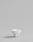 White ceramic bowl on a light gray background from 101 Copenhagen at Spacio retail stores in Mumbai & Kolkata.