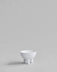White ceramic bowl on a light gray background from 101 Copenhagen at Spacio retail stores in Mumbai & Kolkata.