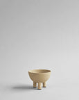 Beige ceramic bowl on a light gray background from 101 Copenhagen at Spacio retail stores in Mumbai & Kolkata.