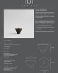 Product information card for a black ceramic duck jar with design details on a gray background