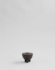 Small coffee ceramic bowl on a light gray background from 101 Copenhagen at Spacio retail stores in Mumbai & Kolkata.