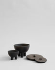 Set of Coffee colour ceramic bowls and lids on a light gray background from 101 Copenhagen at Spacio retail stores in Mumbai & Kolkata.