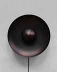 Dusk Wall Light Burned Black by 101 Copenhagen on a light grey background available at Spacio retail stores in Mumbai & Kolkata.