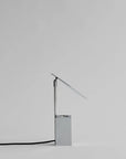 Modern table lamp with a minimalist design on a light gray background