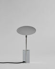 Modern table lamp with a round shade on a gray background