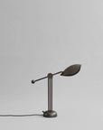 Vintage-style desk lamp on a light gray background from 101 Copenhagen available at Spacio retail stores in Mumbai & Kolkata.