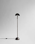 Black floor lamp on a white background