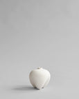 White ceramic vase on a light gray background from 101 Copenhagen at Spacio retail stores in Mumbai & Kolkata.