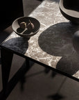 Dark marble table with decorative items from 101 Copenhagen at Spacio retail stores in Mumbai & Kolkata.