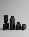 A group of 101Cph Cobra Fat Medio Black 212004 vases on a white background, inspired by the 101 Copenhagen Cobra movement.