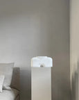 A 101Cph Cobra Fat Medio Bubble White 201011 bed in a room with a white bedside table, featuring the White colour.