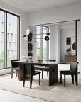 A modern dining table and chairs in a room with large windows. The dining set features the 101Cph Empire Mini Dark Grey 223036 table, which is made of ceramic and comes in a stylish dark grey color.