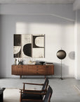 A modern living room with white walls and wooden furniture featuring the 101Cph Empire Mini Dark Grey 223036 color and ceramic accents by 101 Copenhagen.