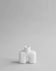 A small 101Cph Cobra Uno Mini Bubble White 203021 vase on a grey background.