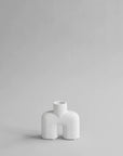 A small 101Cph Cobra Uno Mini Bubble White 203021 vase on a grey background.