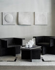 Two black 101Cph Cobra Uno Mini Bubble White 203021 chairs in a living room, featuring the Cobra Uno Mini Bubble design by 101 Copenhagen.