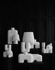 A black and white photo of a group of 101Cph Cobra Uno Mini Bubble White 203021 sculptures by 101 Copenhagen, all in white color.