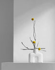 This is a 101Cph Cobra Uno Mini Bubble White 203021 photo of a vase with yellow flowers. The product is by the brand 101 Copenhagen.