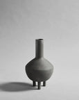 A small 101Cph Duck Fat Dark Grey 111281 vase by 101 Copenhagen on a white background.