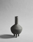 A small 101Cph Duck Fat Dark Grey 111281 vase by 101 Copenhagen on a white background.