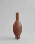A 101Cph Duck Vase Slim Terracotta 213044 on a grey background.