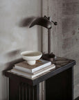 Bowl, coffee table books and a lamp styled on Fibre concrete and calacatta marble top console from 101 Copenhagen at Spacio retail stores in Mumbai & Kolkata.