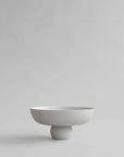 White ceramic bowl on a light gray background from 101 Copenhagen at Spacio retail stores in Mumbai & Kolkata.
