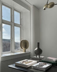 A room with a 101Cph Duck Fat Dark Grey 111281 desk, books, and a window decorated in dark grey color.
