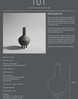 A black and white image of a 101Cph Duck Fat Dark Grey 111281 vase with a dark grey color.