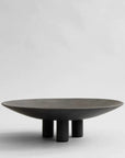 A black 101Cph Duck Plate Big Coffee 214049 by 101 Copenhagen on a white background with a Scandinavian home aesthetic.
