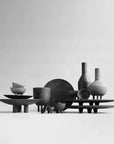 A group of 101 Copenhagen Duck Plate Big Coffee 214049 vases and bowls on a white background, perfect for Scandinavian home decor.