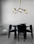 A Scandinavian home with a 101Cph Duck Plate Big Coffee 214049 dining table and chairs by 101 Copenhagen.