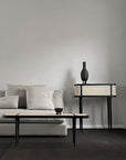 A living room with a 101Cph Duck Slim Coffee 111280 coffee table from 101 Copenhagen.