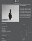 A ceramic black vase with the 101 Copenhagen Duck Slim Coffee 111280 on it.