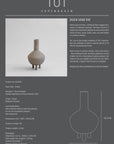 A quirky 101Cph Duck Vase Fat Taupe 213045 with the number 101 on it, inspired by the Copenhagen Duck Vase and the Cobra Arts Movement.