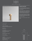 A quirky brochure featuring a picture of a table adorned with a small object, showcasing the 101Cph Empire Mini Sand 223037 vase from the Cobra Arts Movement.