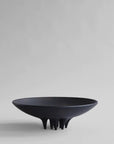 A black Medusa Tray Big Coffee 221063 by 101Cph Copenhagen sitting on top of a white surface, resembling a coffee tray.