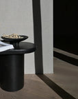 A 101Cph Medusa Tray Mini Coffee 221064 side table with a book on it.
