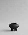 A 101Cph Medusa Vase Mini Coffee 221062 by 101 Copenhagen sitting on a white surface.