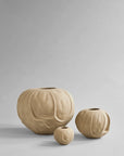 Three beige ceramic vases of different sizes on a light gray background from 101 Copenhagen at Spacio retail stores in Mumbai & Kolkata.