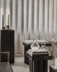 Modern interior with dark furniture and light curtains from 101 Copenhagen